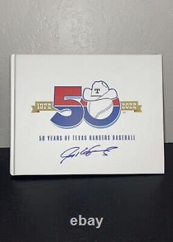 Texas Rangers 50th Anniversary Book Signed By Pudge Rodriguez / Micheal Young